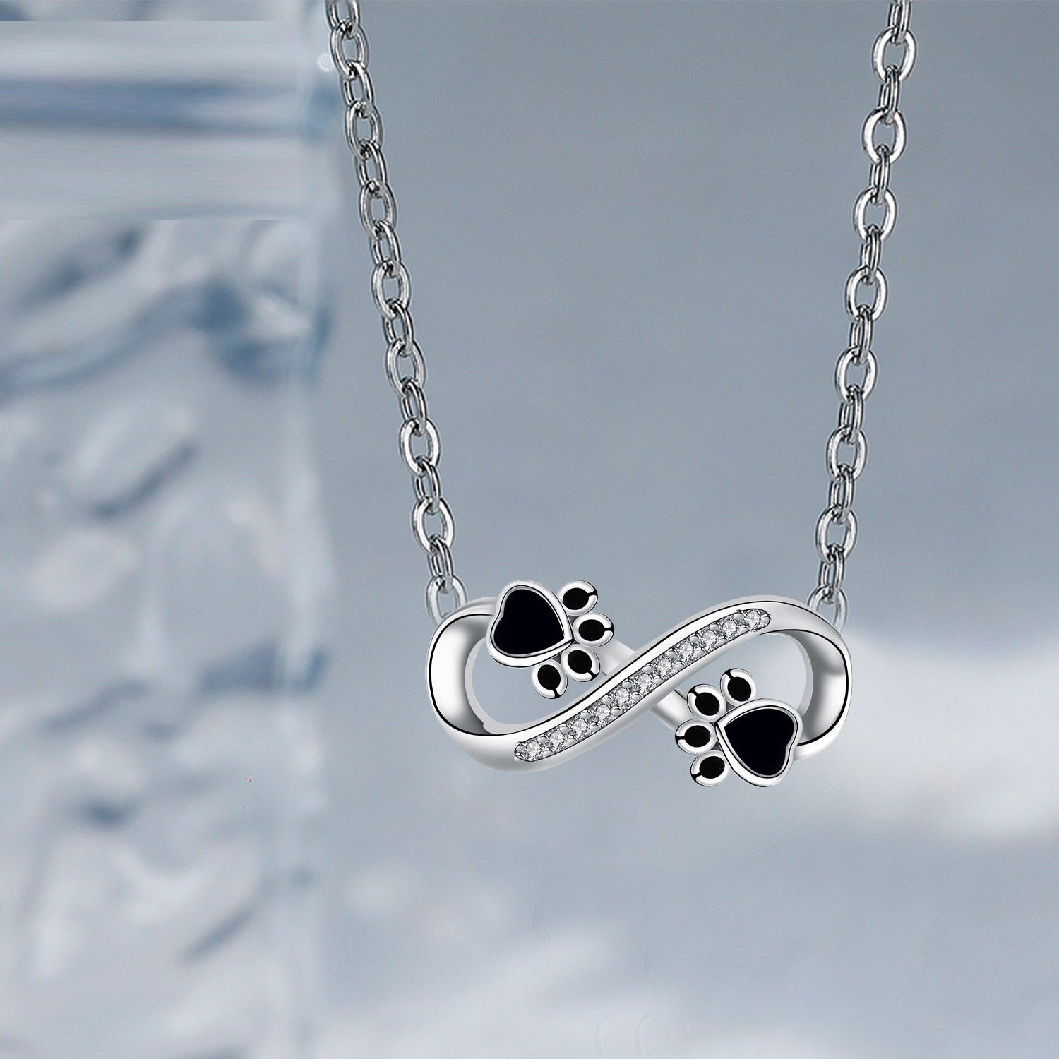 Collana con impronta di zampa infinito con zirconia - Emma e Gemma