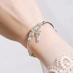 Bracciale Regolabile in Argento Sterling 925 con Charms a Foglia Tripla, immagine 2 - Emma e Gemma