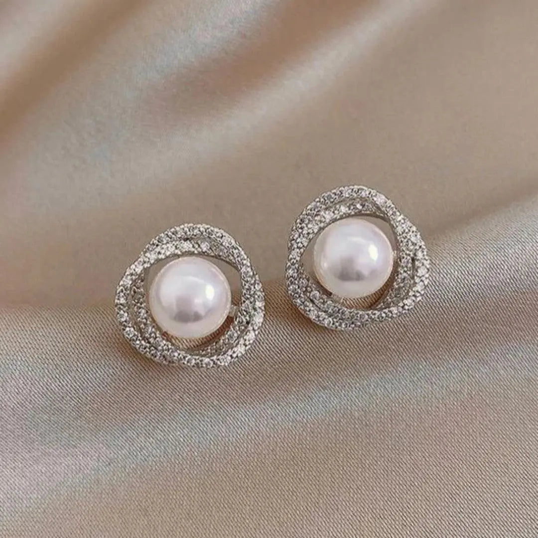 Orecchini a spirale lucidi con eleganti perle - Emma e Gemma