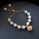 Bracciale a Conchiglia con Perle in Oro - Emma e Gemma