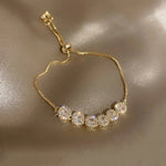 Bracciale di Lusso Regolabile con Zirconia Dorata - Emma e Gemma