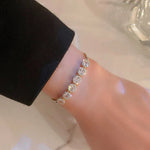 Bracciale di Lusso Regolabile con Zirconia Dorata, immagine 2 - Emma e Gemma