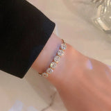 Bracciale di Lusso Regolabile con Zirconia Dorata, immagine 2 - Emma e Gemma