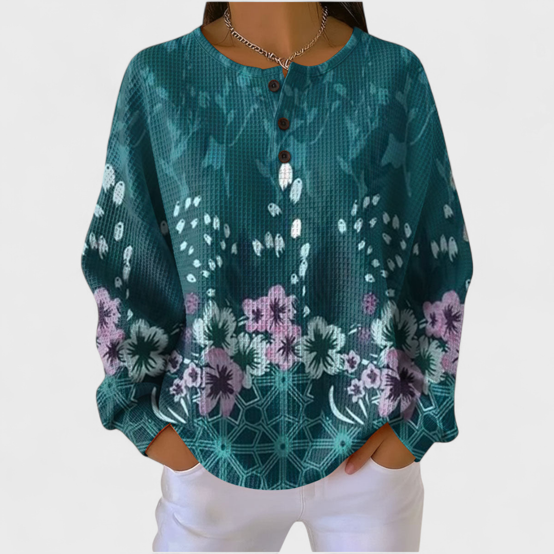 Nora - Maglione color petrolio con design floreale