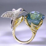 Anello Regolabile Colore Acquamarina con Colibrì – Placcato Oro 14K - Emma e Gemma
