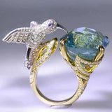 Anello Regolabile Colore Acquamarina con Colibrì – Placcato Oro 14K - Emma e Gemma