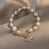 Braccialetto Charm a Farfalla in Oro e Perle con Cristalli - Emma e Gemma