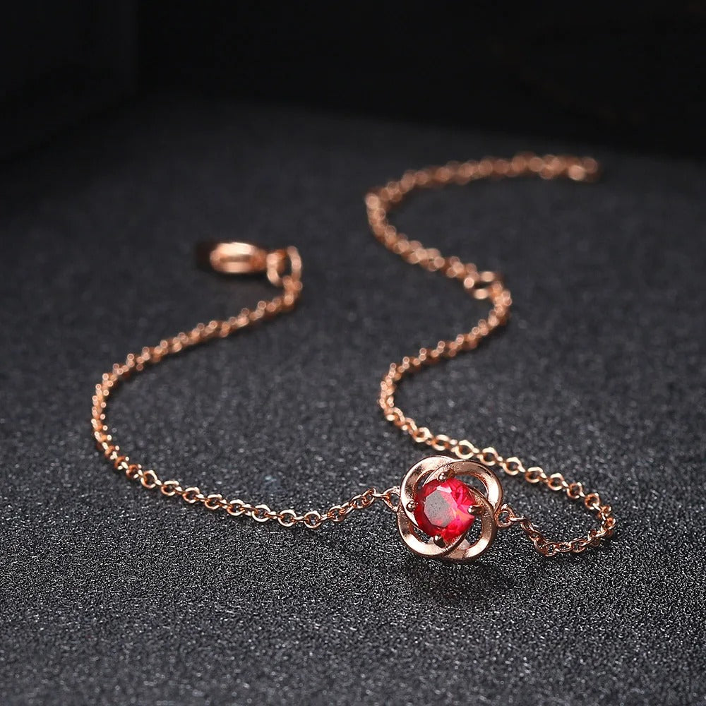 Bracciale con Pendente a Fiore in Cristallo Rosso e Oro Rosa - Emma e Gemma