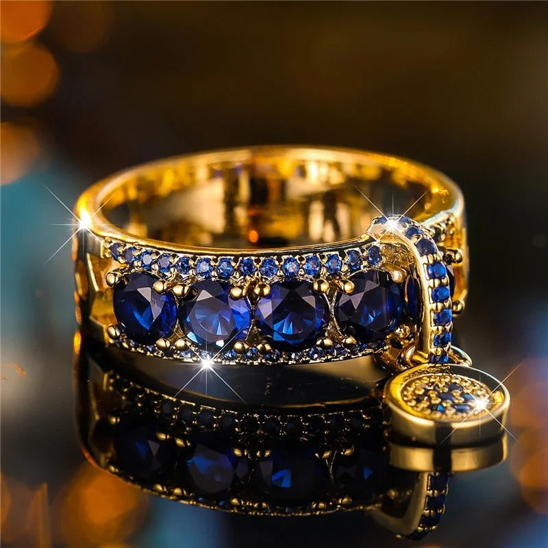 Anello Dichiarativo in Oro Antico e Cristallo Blu - Emma e Gemma