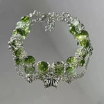 Bracciale Vintage in Argento con Farfalla e Perle Verdi - Emma e Gemma