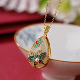 Collana Vintage in Perle con Design di Farfalle e Fiori in Oro Classico - Emma e Gemma