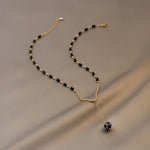 Collana a pendente in oro vintage con perline nere - Emma e Gemma